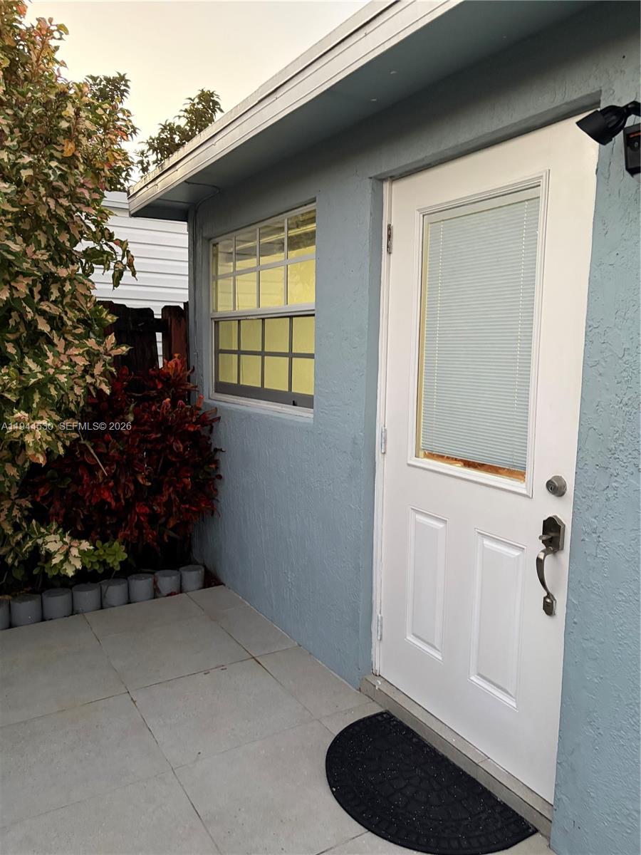 11956 Southwest 209th Street Miami, FL 33177 - Photo 2 of 14 a room that has a rug and a chair