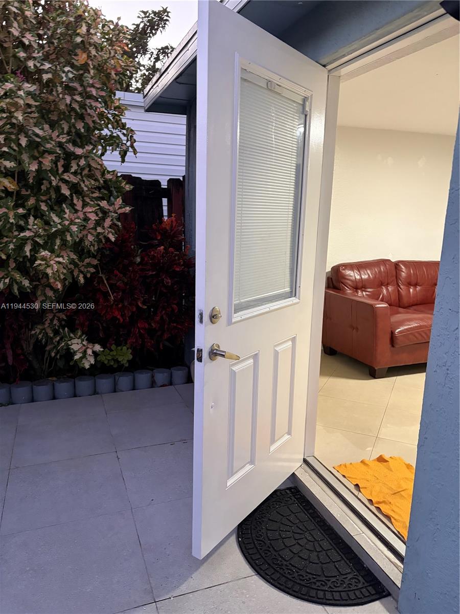 11956 Southwest 209th Street Miami, FL 33177 - Photo 3 of 14 a view of front door