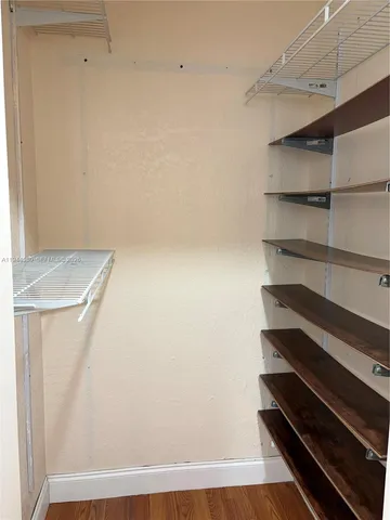 a view of room with racks on the wall