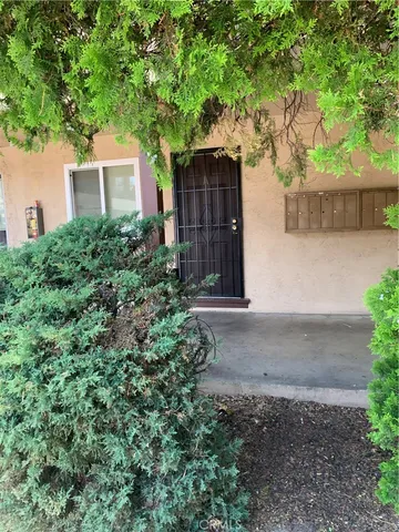 a house with a tree in front of it