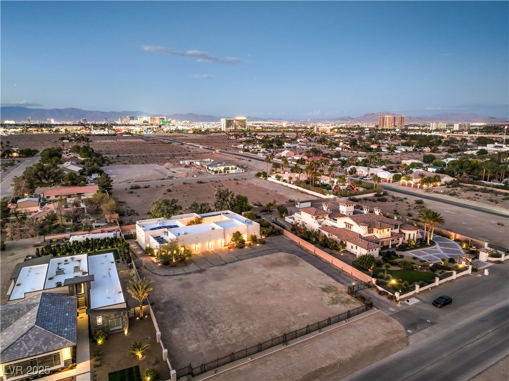 3910 West Pebble Road Las Vegas, NV 89139 - Photo 54 of 59 Aerial perspective of suburban area featuring a mountain backdrop