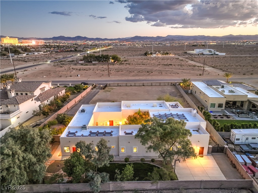 3910 West Pebble Road Las Vegas, NV 89139 - Photo 56 of 59 Aerial view at dusk of a mountain view and view of desert