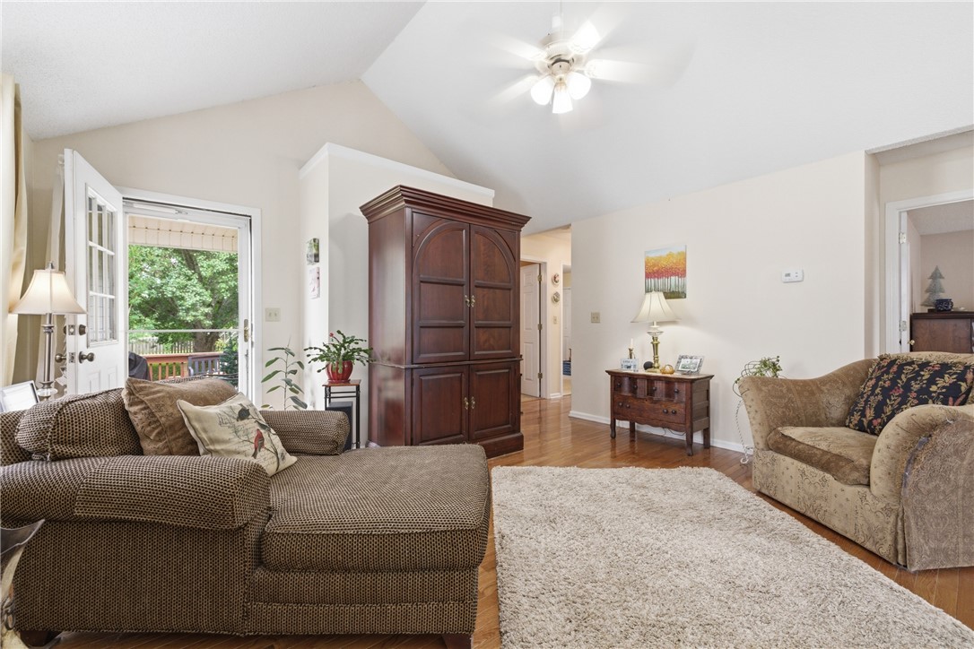 128 Kelly Lane Easley, SC 29642 - Photo 15 of 23 Hardwood floors and vaulted ceilings create an inviting and airy living space, perfect for everyday comfort.