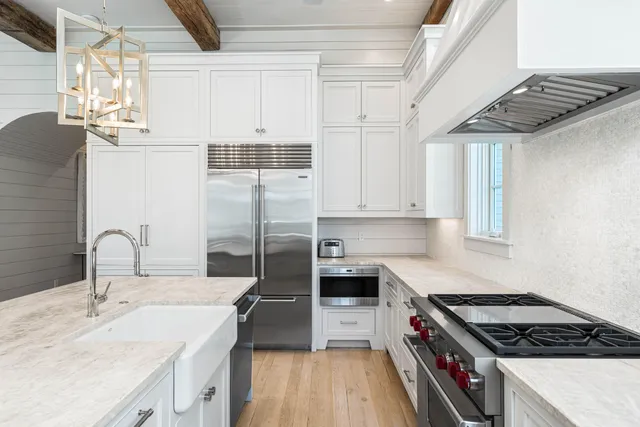 a room with table chairs and a flat screen tv