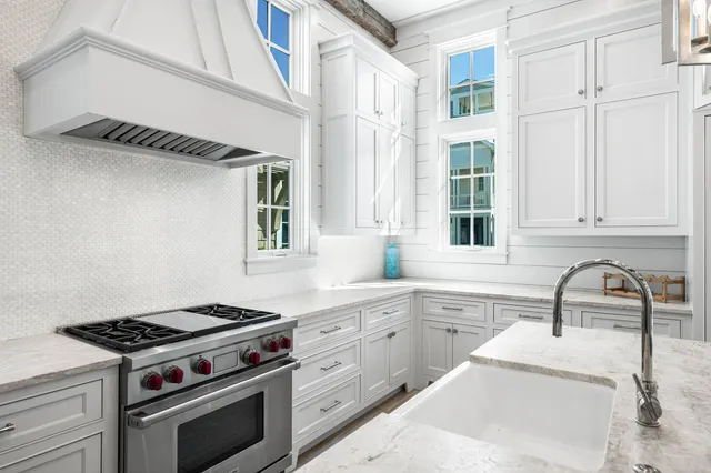 a bathroom with a sink shower and a mirror