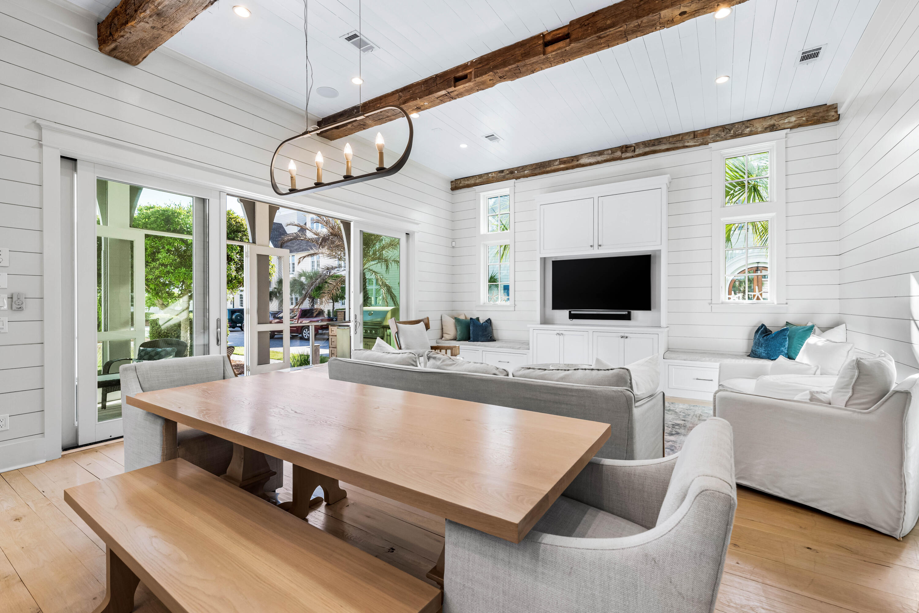 10 Rainer Ln Inlet Beach Inlet Beach, FL 32461 - Photo 16 of 55 a room with table chairs and a flat screen tv