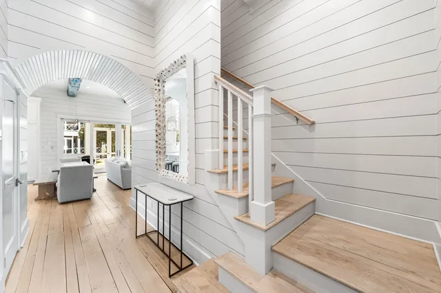 a bedroom with a bed and a flat tv screen on dresser