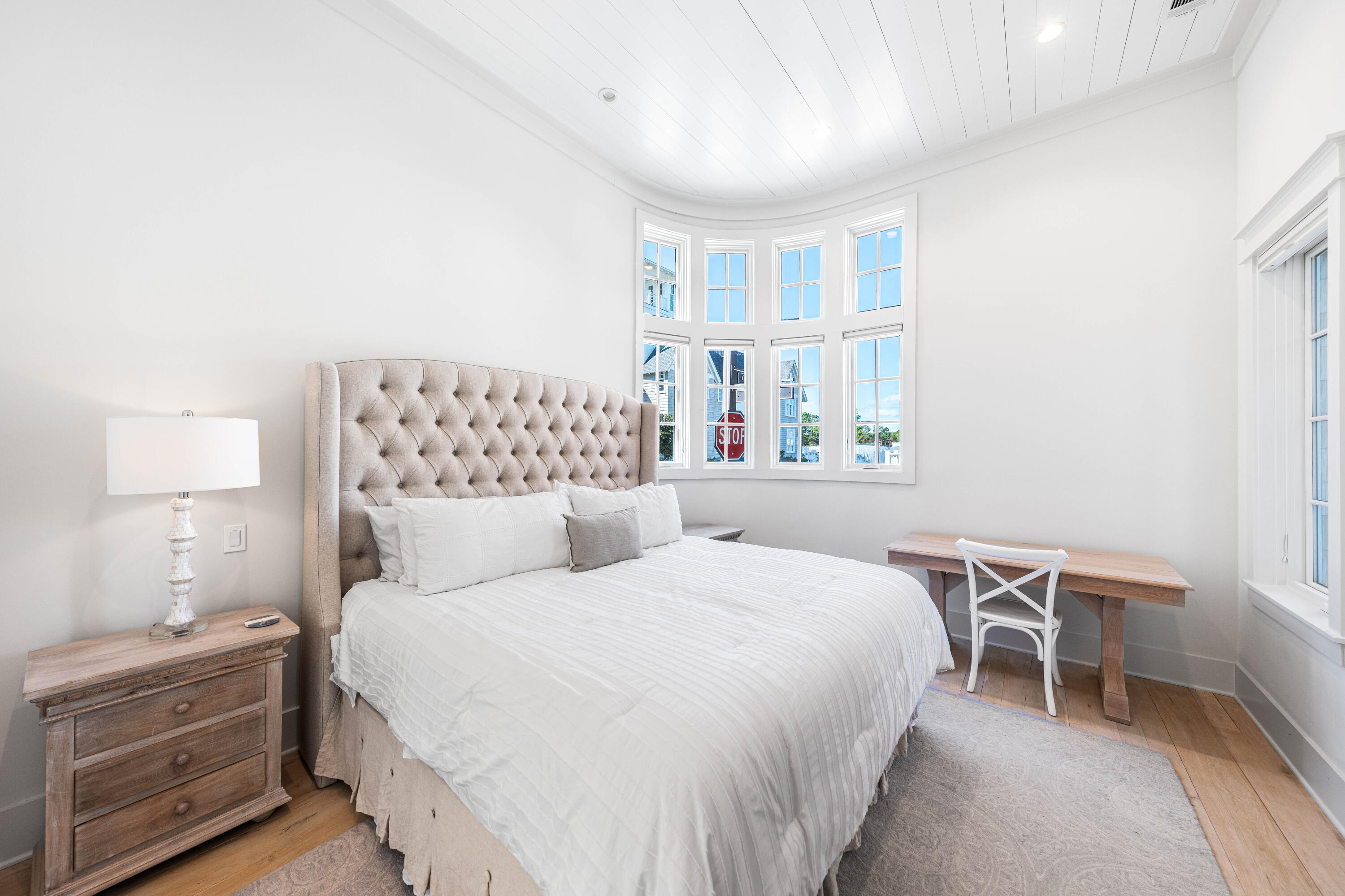 10 Rainer Ln Inlet Beach Inlet Beach, FL 32461 - Photo 19 of 55 a bedroom with a bed and a lamp on dresser