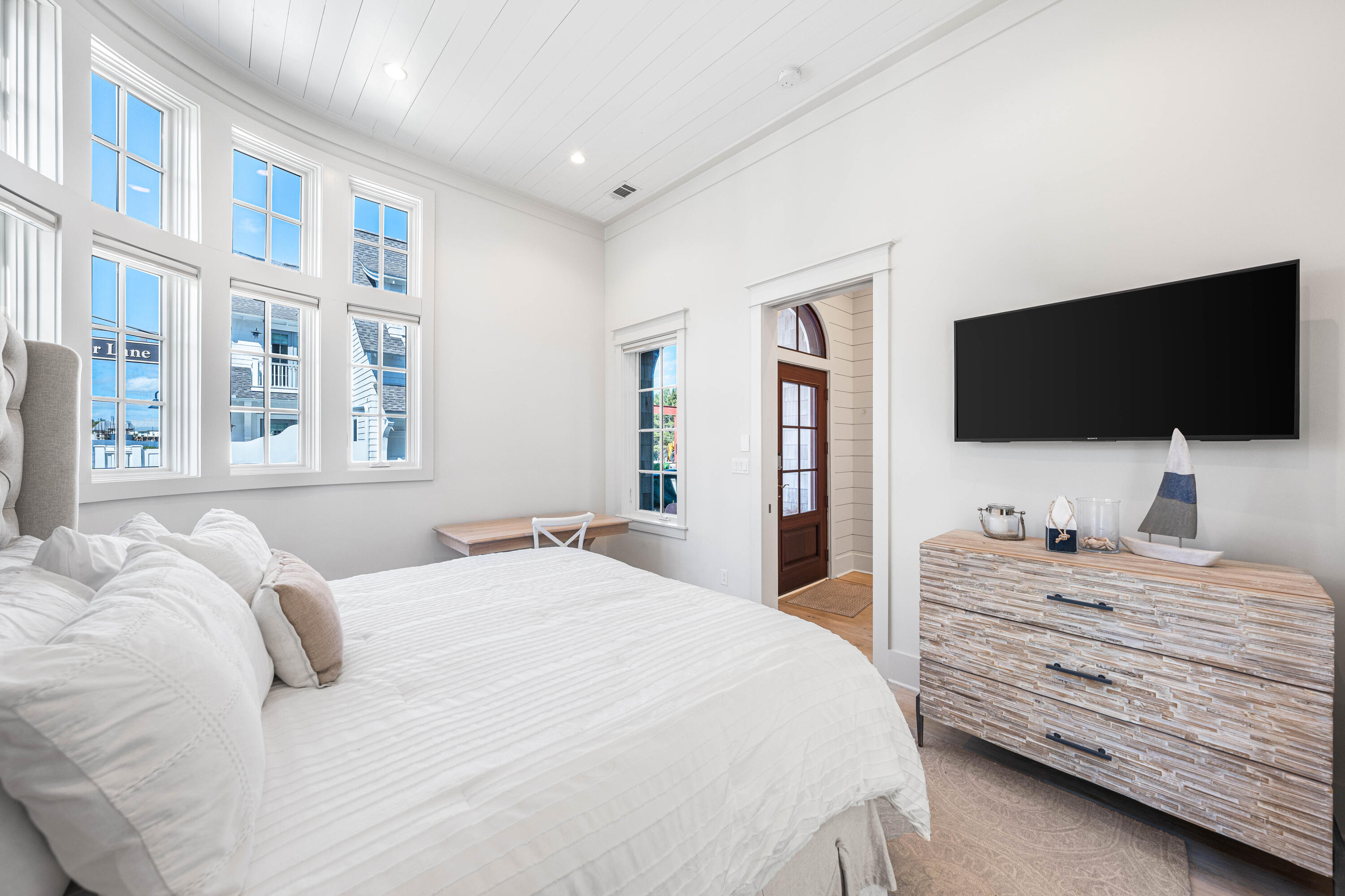 10 Rainer Ln Inlet Beach Inlet Beach, FL 32461 - Photo 20 of 55 a bedroom with a bed and a flat tv screen on dresser
