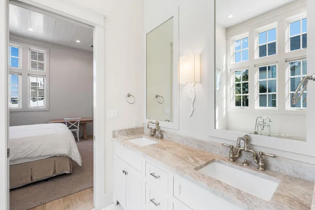 a bathroom with a mirror and a shower