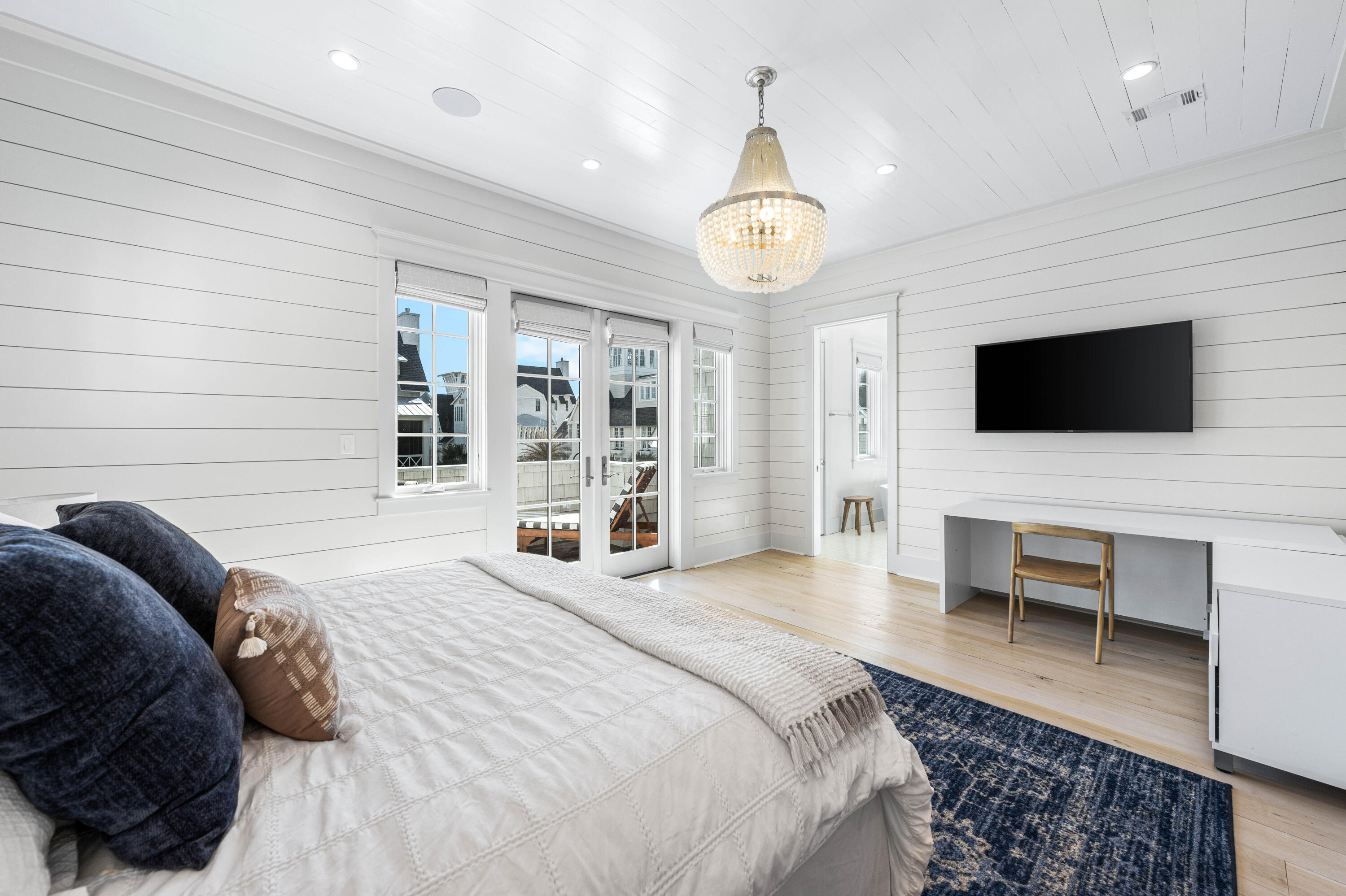 10 Rainer Ln Inlet Beach Inlet Beach, FL 32461 - Photo 25 of 55 a spacious bedroom with a bed and a flat screen tv