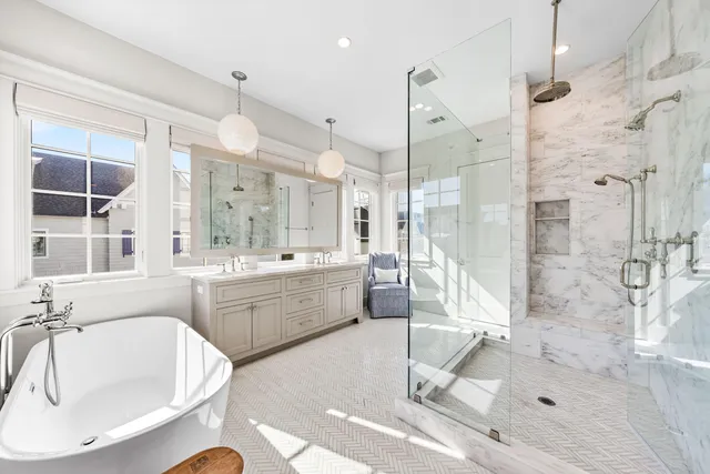 a bedroom with a bed next to a window