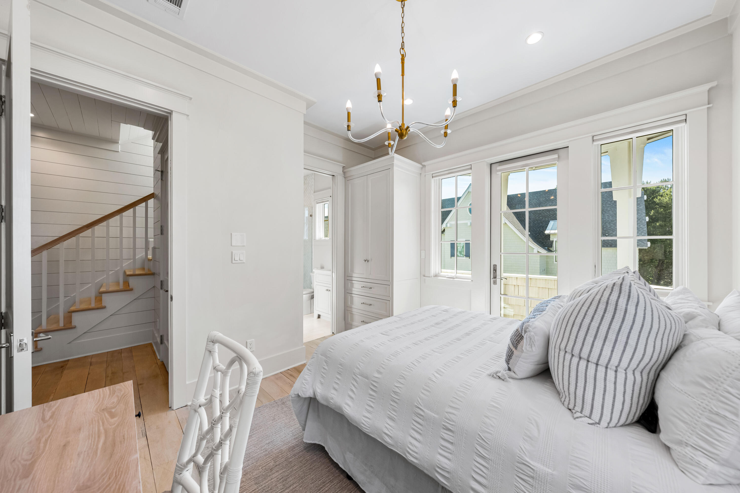 10 Rainer Ln Inlet Beach Inlet Beach, FL 32461 - Photo 32 of 55 a bedroom with a bed ceiling fan and a large window