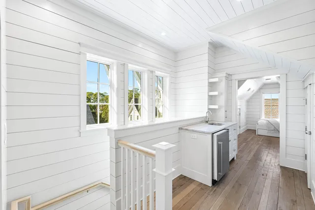 a bedroom with a large bed and a large window