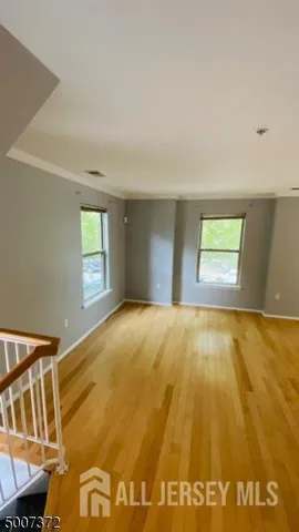 a view of an empty room with windows