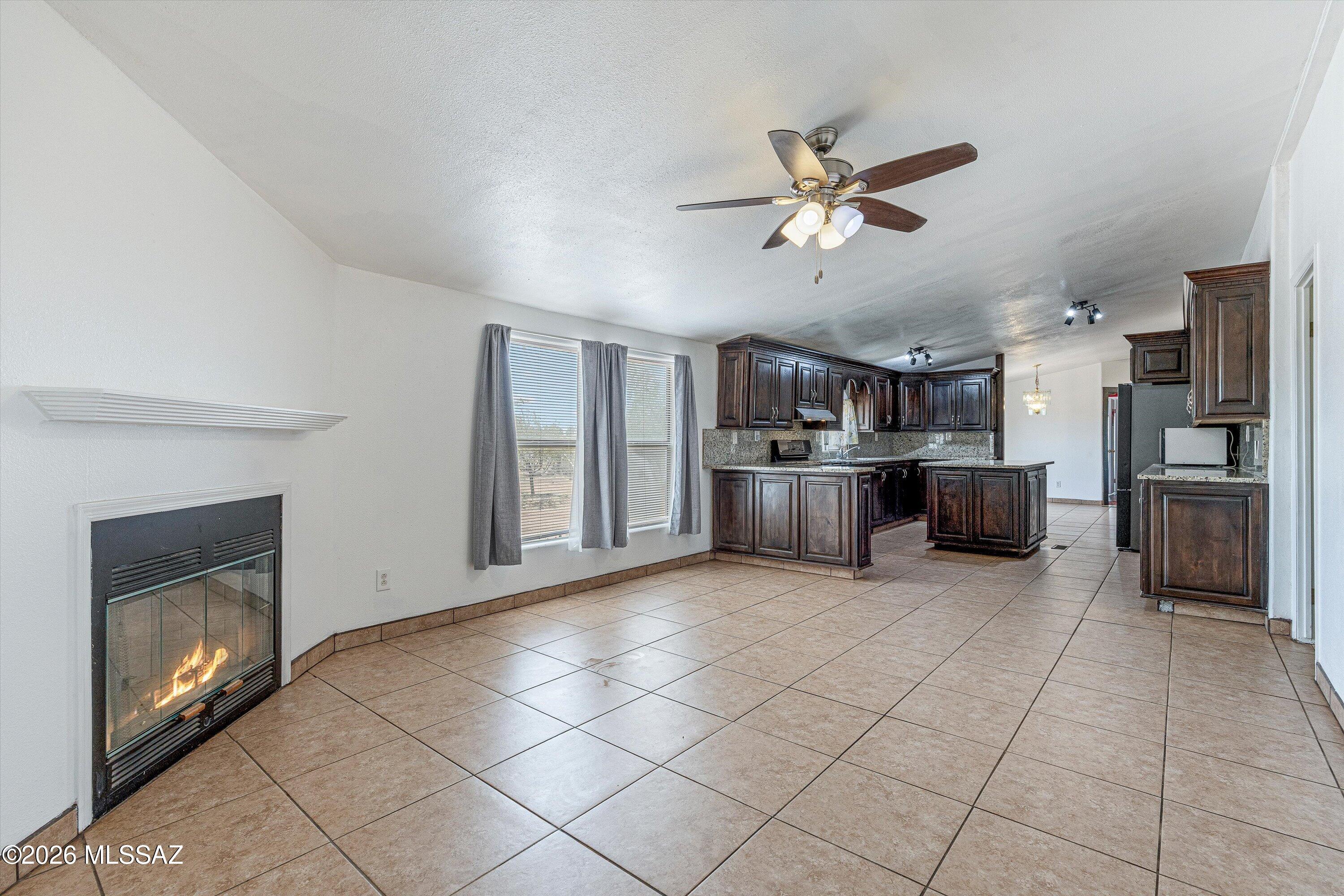 10935 South Swan Road Tucson, AZ 85756 - Photo 5 of 41 View from Family Room into Kitchen and Dining