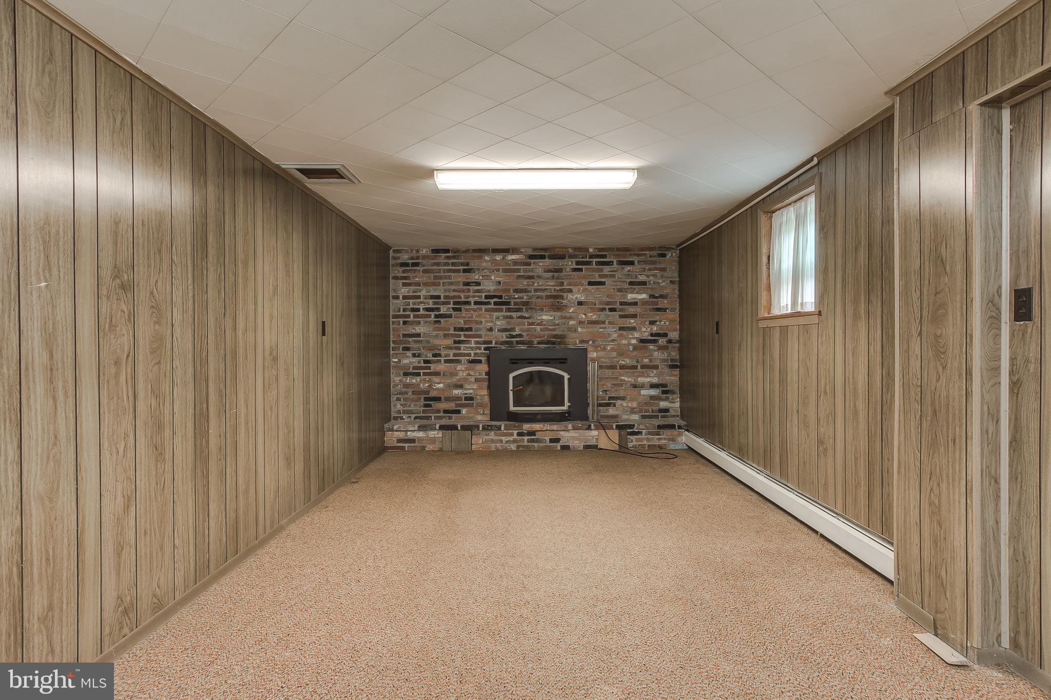 13516 Herman Myers Road Hagerstown, MD 21742 - Photo 20 of 35 Partially finished basement with fireplace