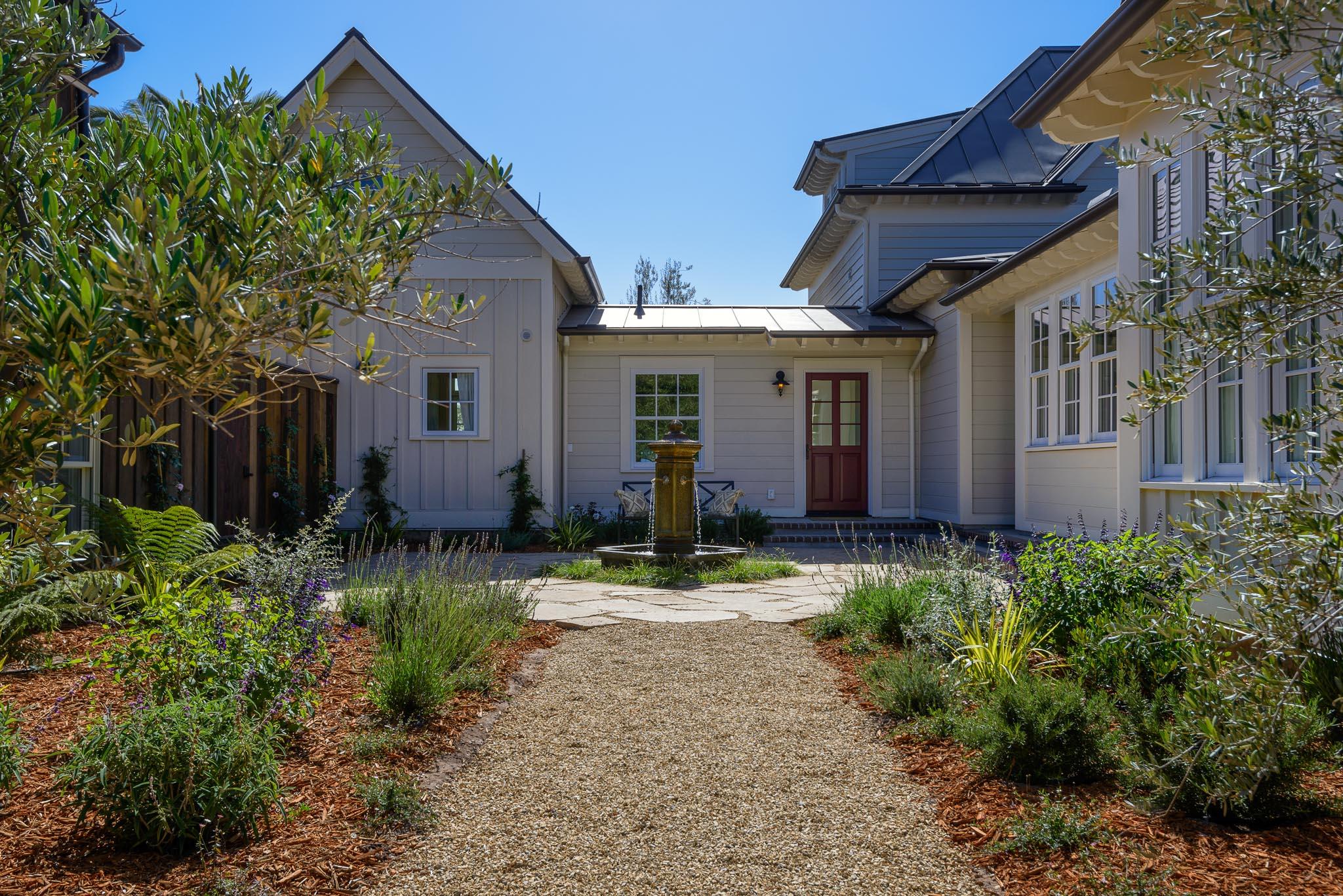130 Tiburon Bay Lane Montecito, CA 93108 - Photo 21 of 31 a backyard of a house with outdoor seating and plants