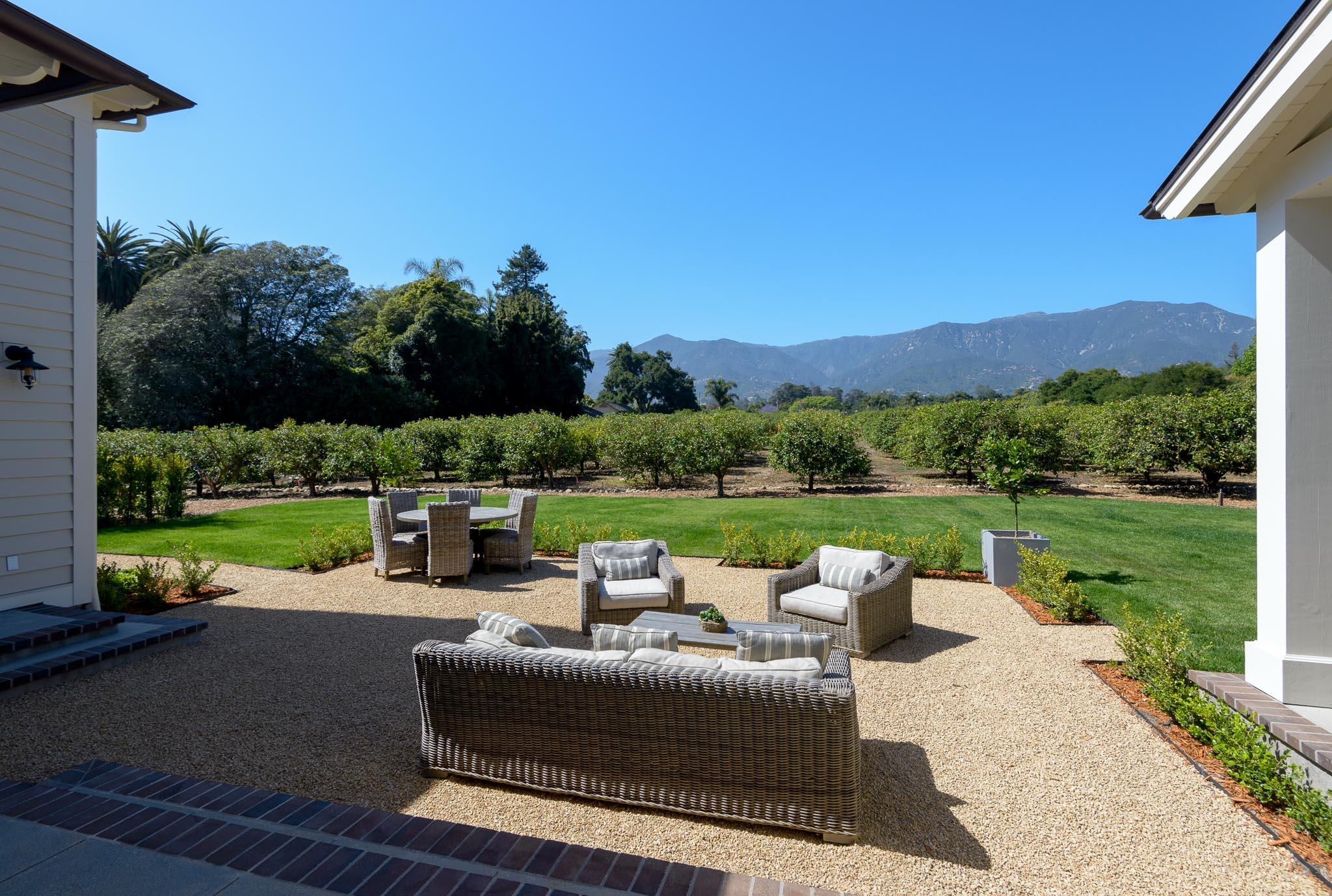 130 Tiburon Bay Lane Montecito, CA 93108 - Photo 26 of 31 a view of a patio with couches potted plants and a big yard