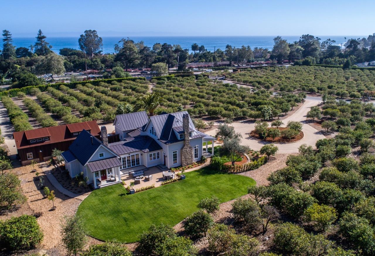 130 Tiburon Bay Lane Montecito, CA 93108 - Photo 3 of 31 an aerial view of a house with a garden and lake view