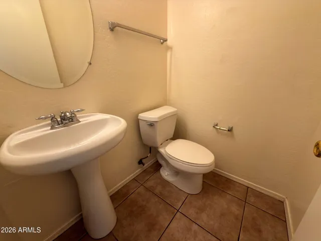 a kitchen with a sink a stove top oven and cabinetry