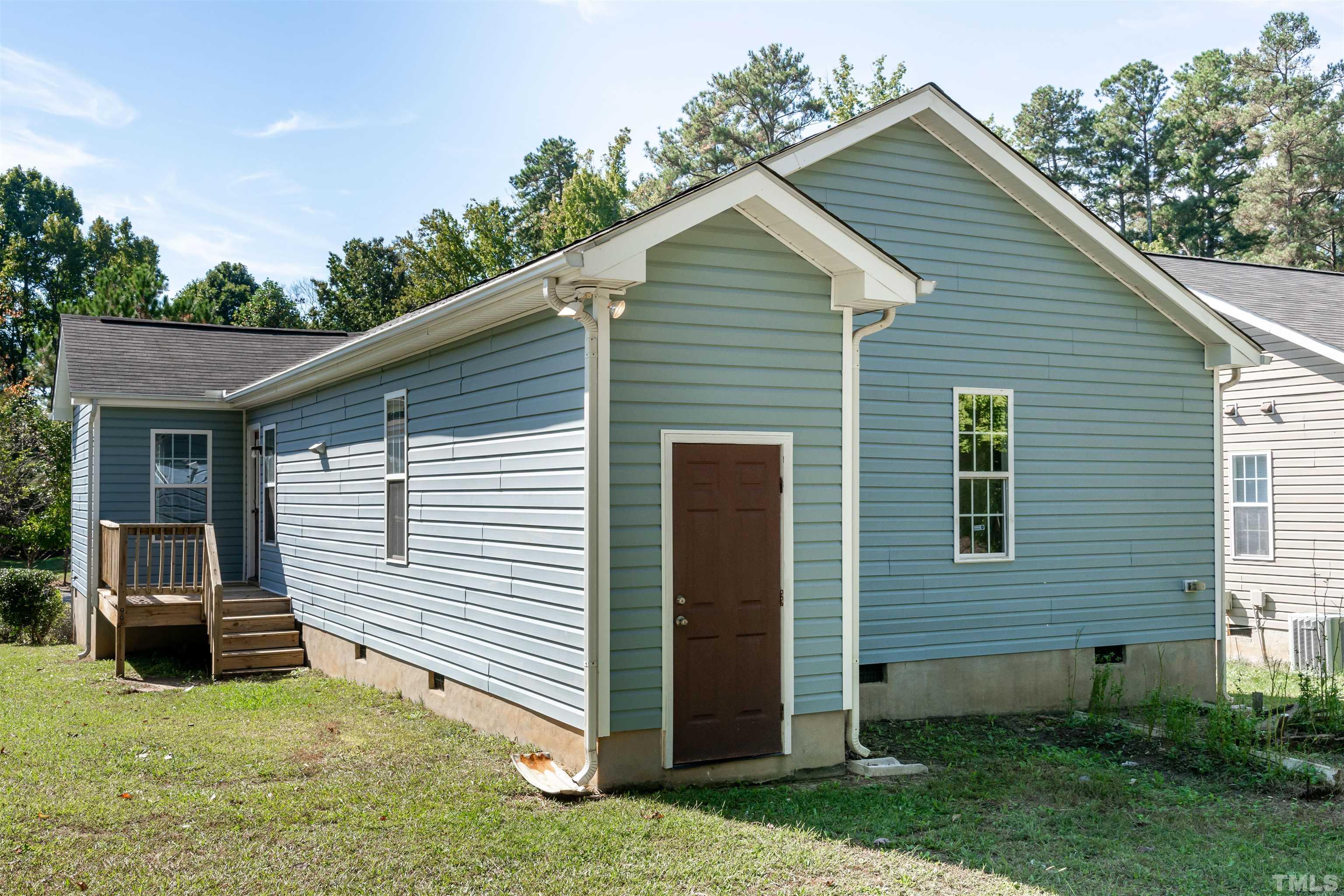 1127 Ricochet Drive Raleigh, NC 27610 - Photo 11 of 21 a view of a house with a yard