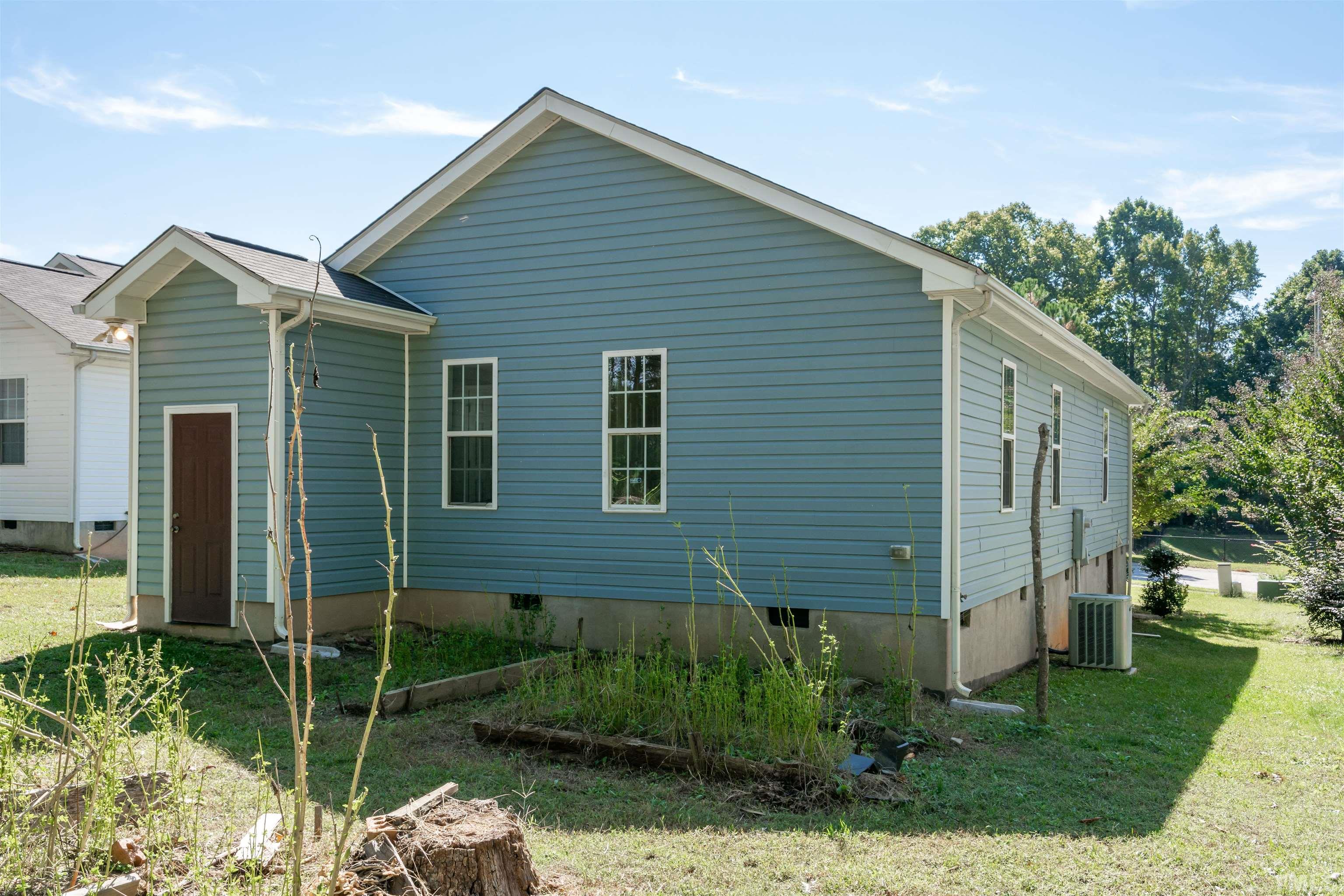 1127 Ricochet Drive Raleigh, NC 27610 - Photo 12 of 21 a front view of a house with garden