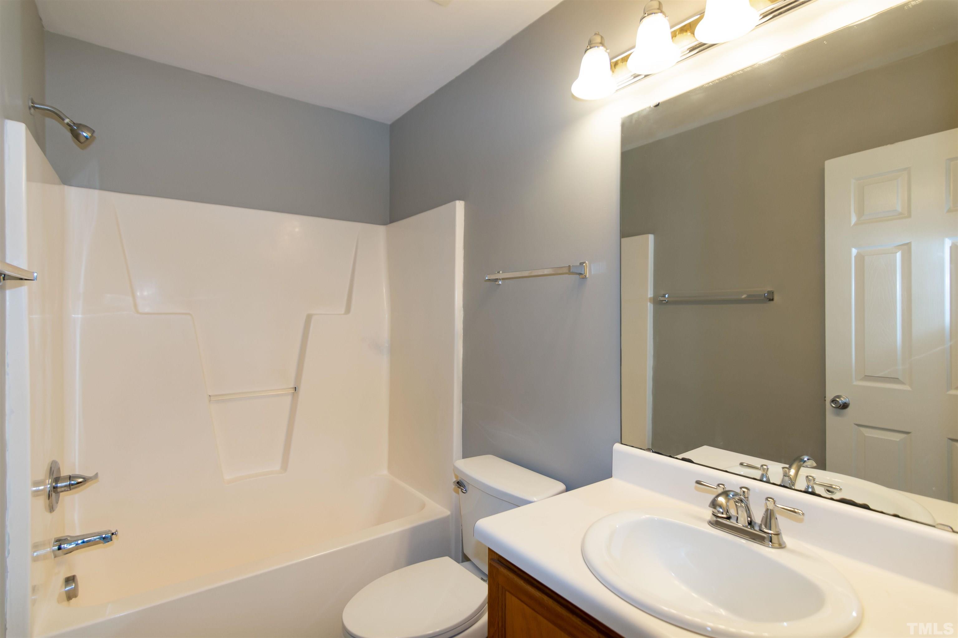 1127 Ricochet Drive Raleigh, NC 27610 - Photo 13 of 21 a bathroom with a sink toilet and shower