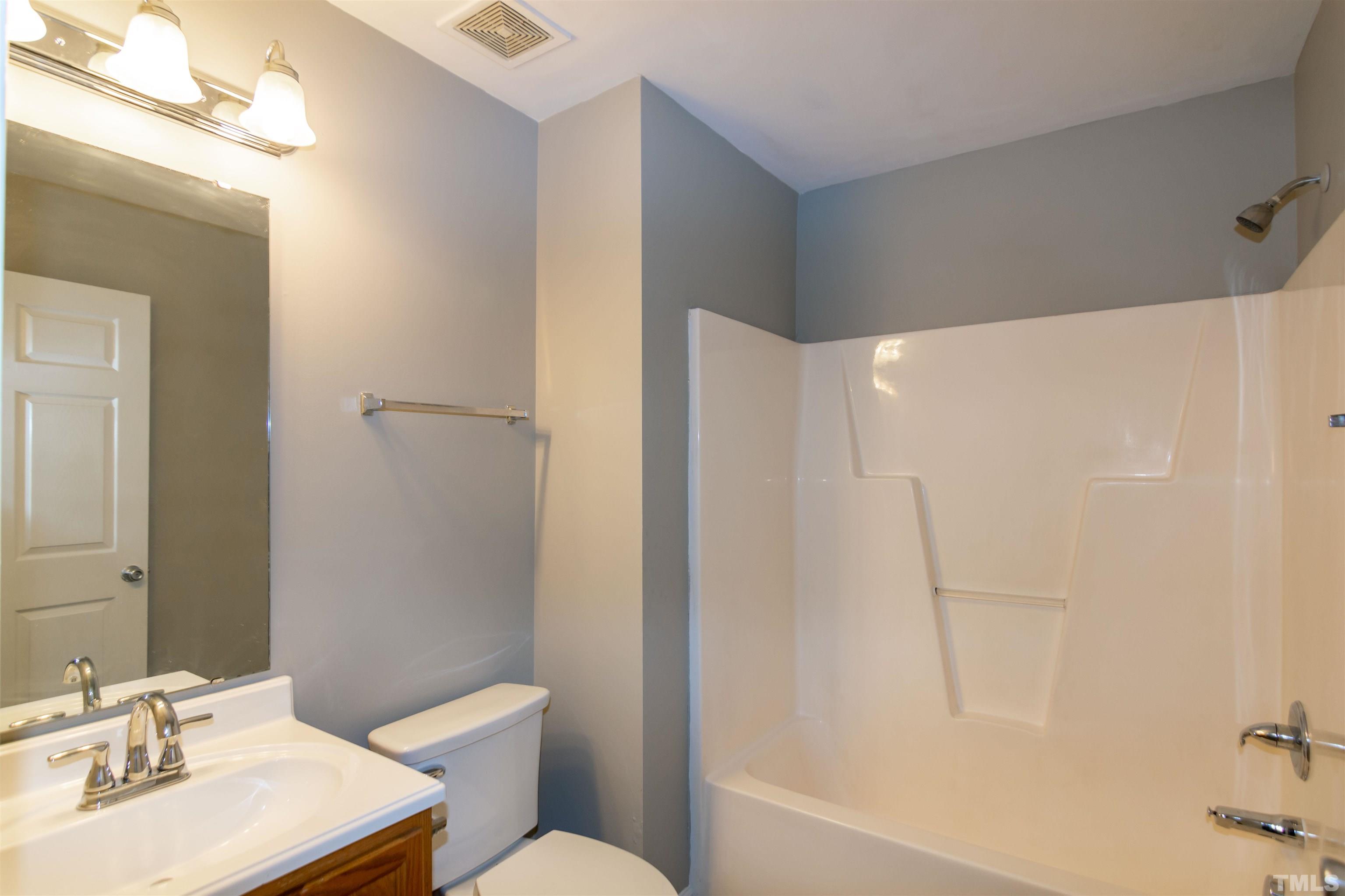 1127 Ricochet Drive Raleigh, NC 27610 - Photo 15 of 21 a bathroom with a sink toilet and shower