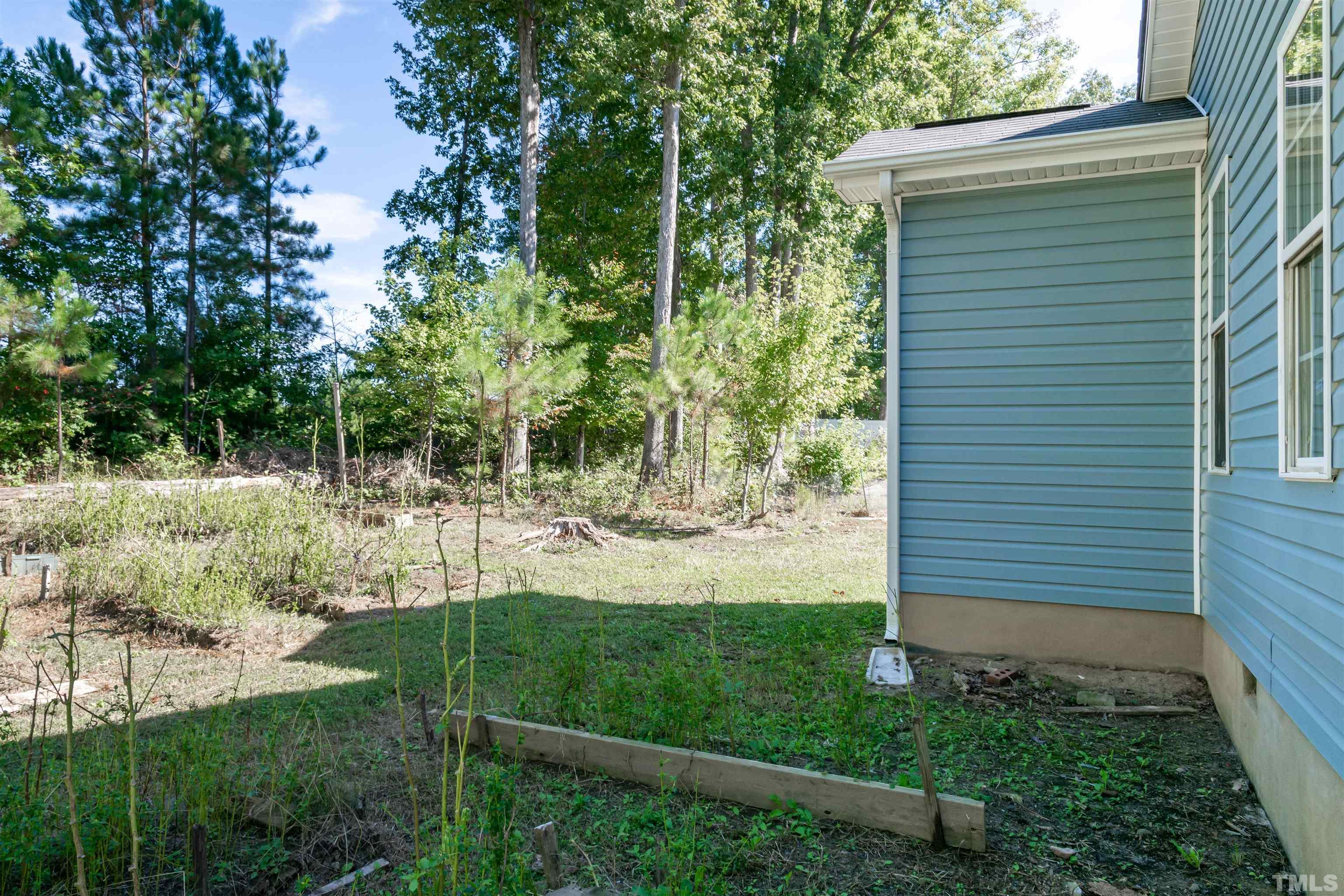 1127 Ricochet Drive Raleigh, NC 27610 - Photo 20 of 21 a view of back yard of the house