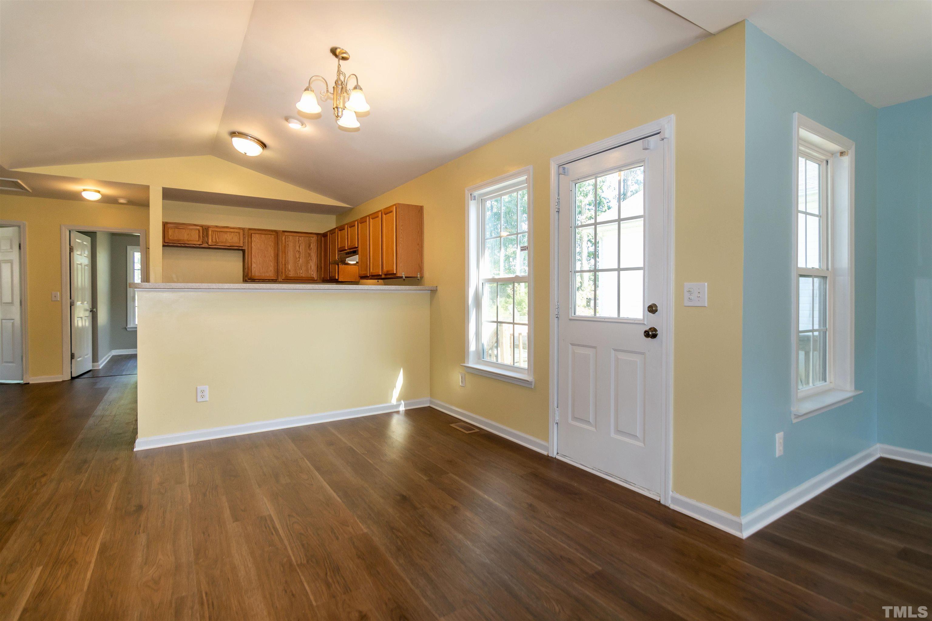 1127 Ricochet Drive Raleigh, NC 27610 - Photo 5 of 21 a view of a room with wooden floor and a window
