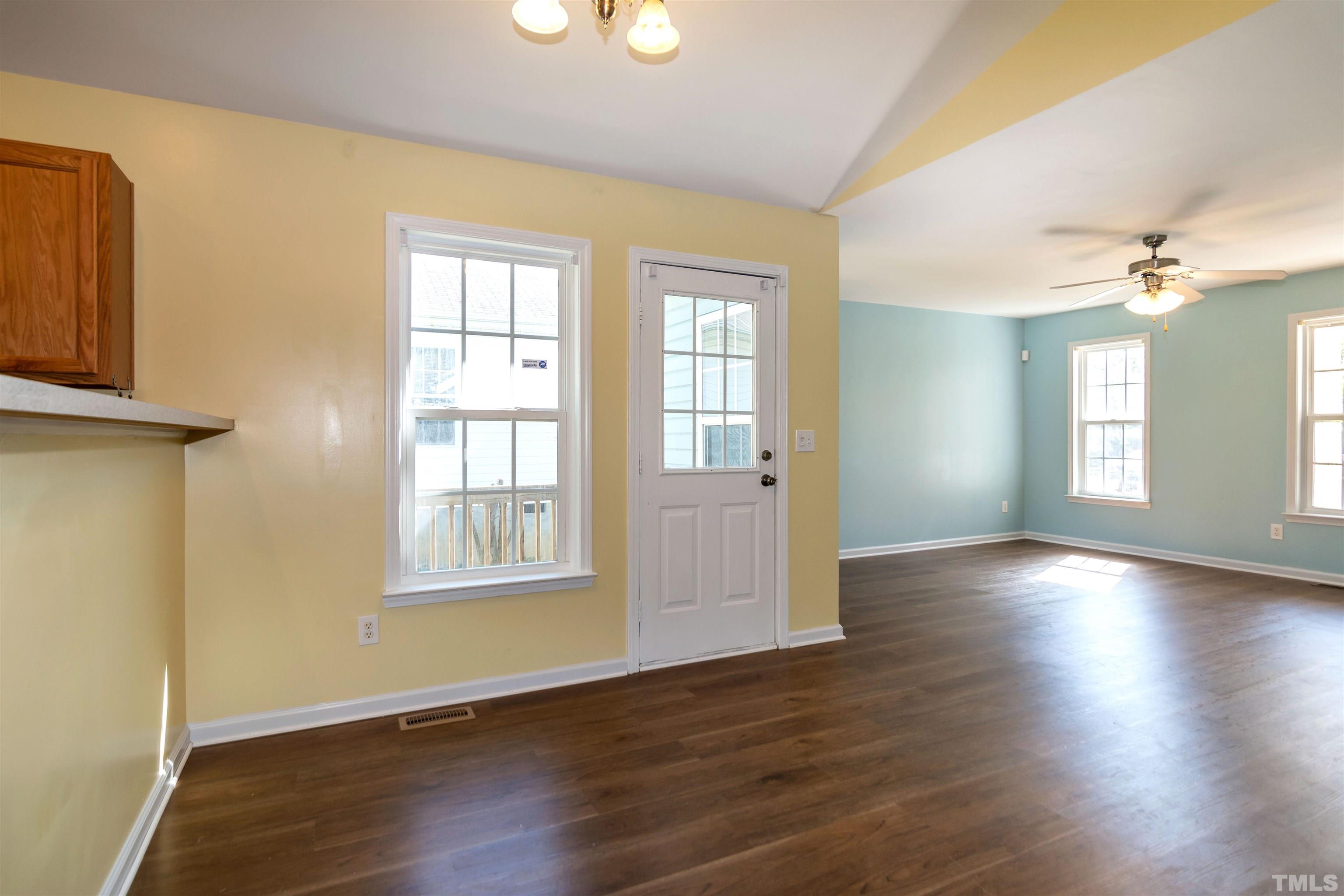 1127 Ricochet Drive Raleigh, NC 27610 - Photo 6 of 21 an empty room with wooden floor and windows