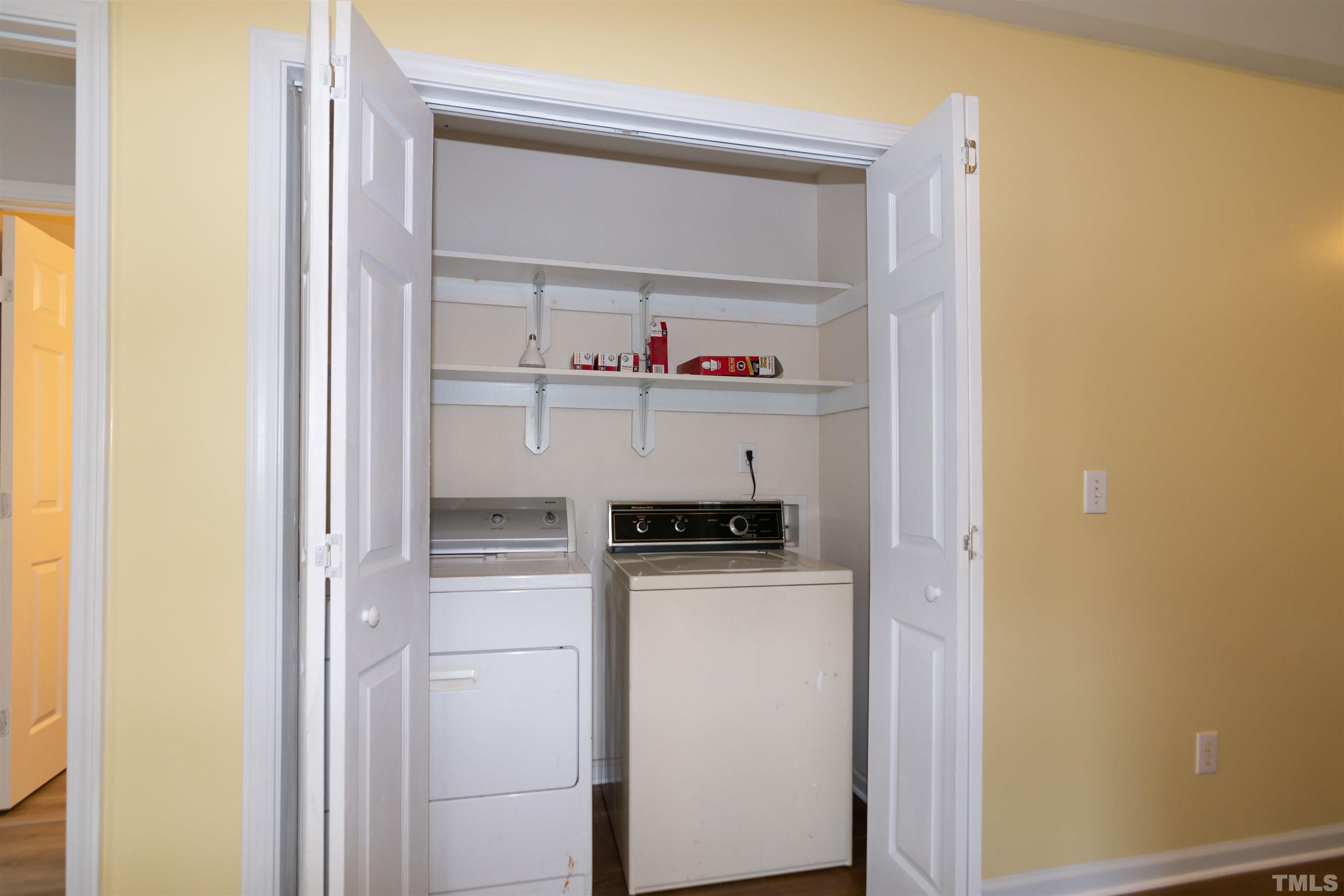 1127 Ricochet Drive Raleigh, NC 27610 - Photo 9 of 21 a utility room with wooden floor washer and dryer