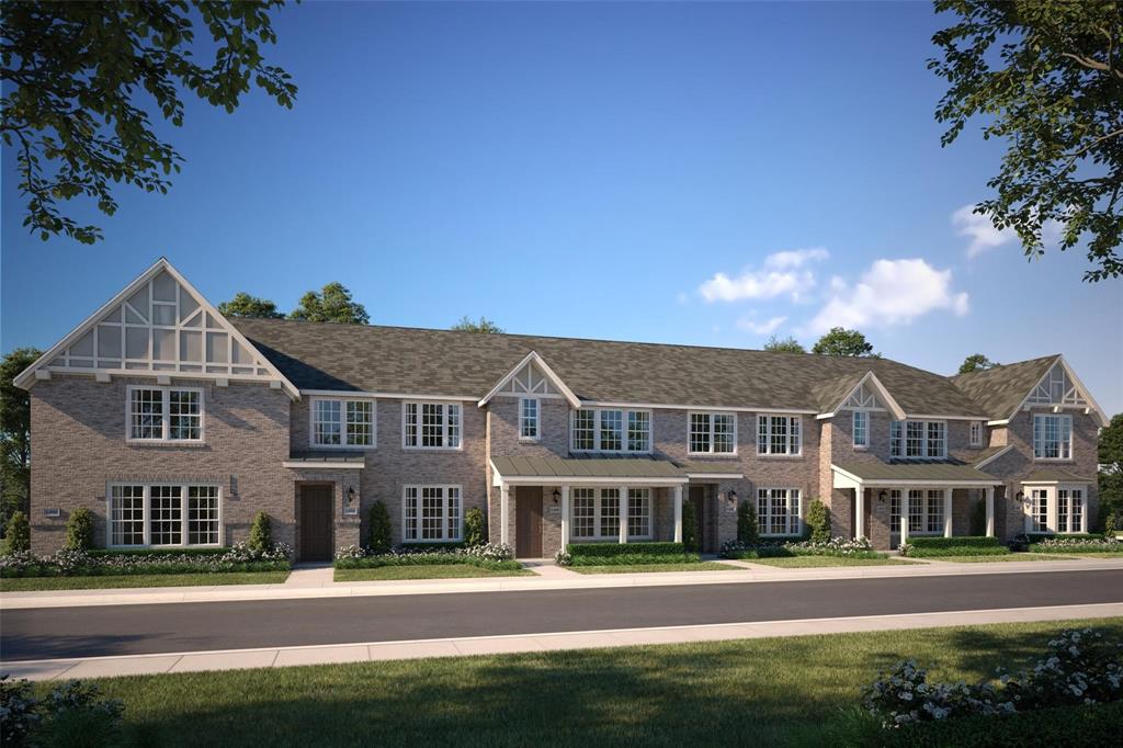 Modern townhome row featuring a blend of brick and siding exteriors