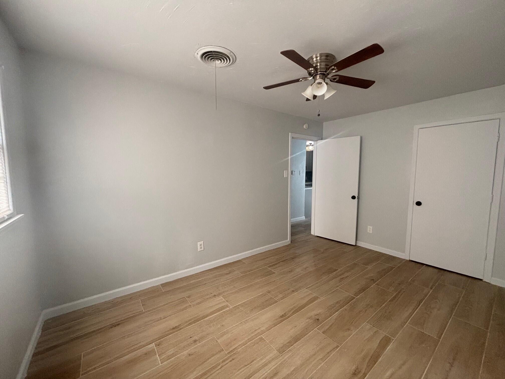 2409 45th Street, Unit 8 Lubbock, TX 79412 - Photo 8 of 8 wooden floor in an empty room