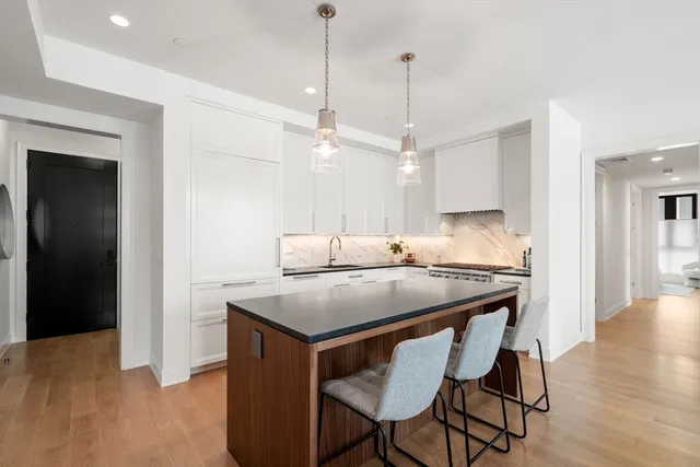 a kitchen with a table and chairs in it