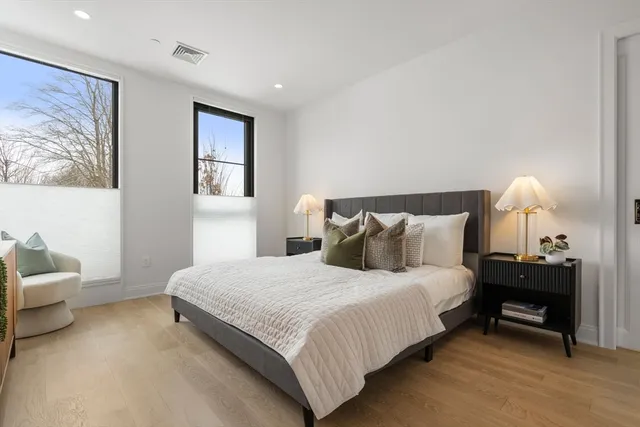 a bedroom with bed and a couch