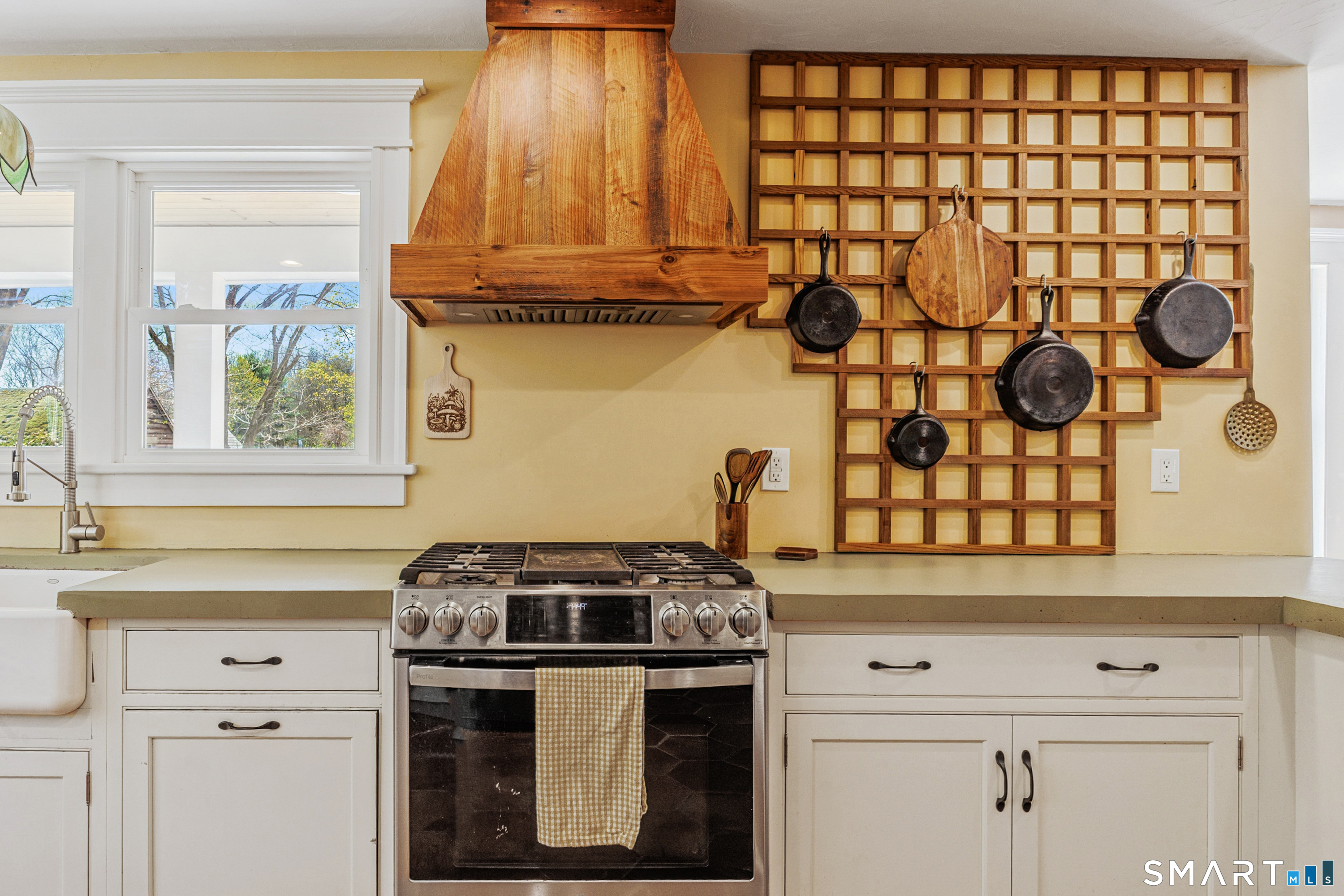 760 Upper Maple Street Killingly, CT 06239 - Photo 19 of 34 a kitchen with a stove and a cabinet