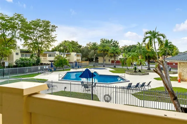 a view of a patio with swimming pool