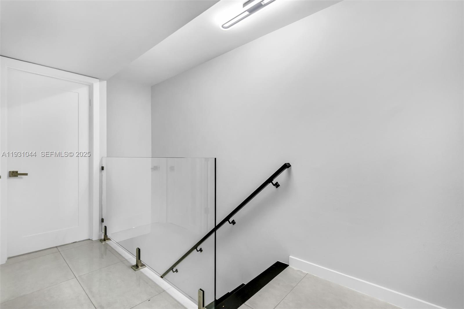 8443 Southwest 137th Avenue, Unit 8443 Miami, FL 33183 - Photo 14 of 29 a view of hallway with stairs