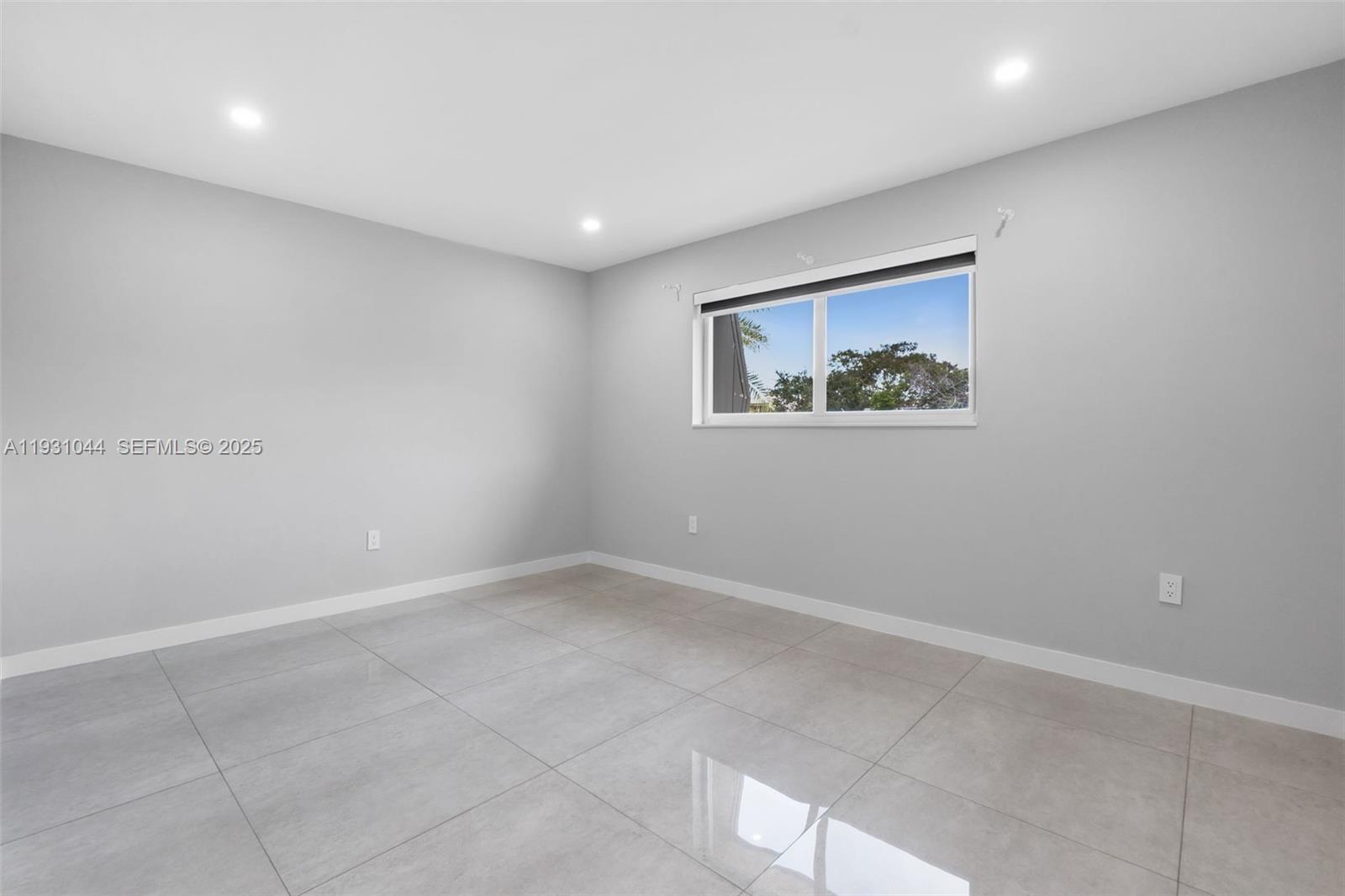 8443 Southwest 137th Avenue, Unit 8443 Miami, FL 33183 - Photo 23 of 29 an empty room with a painting