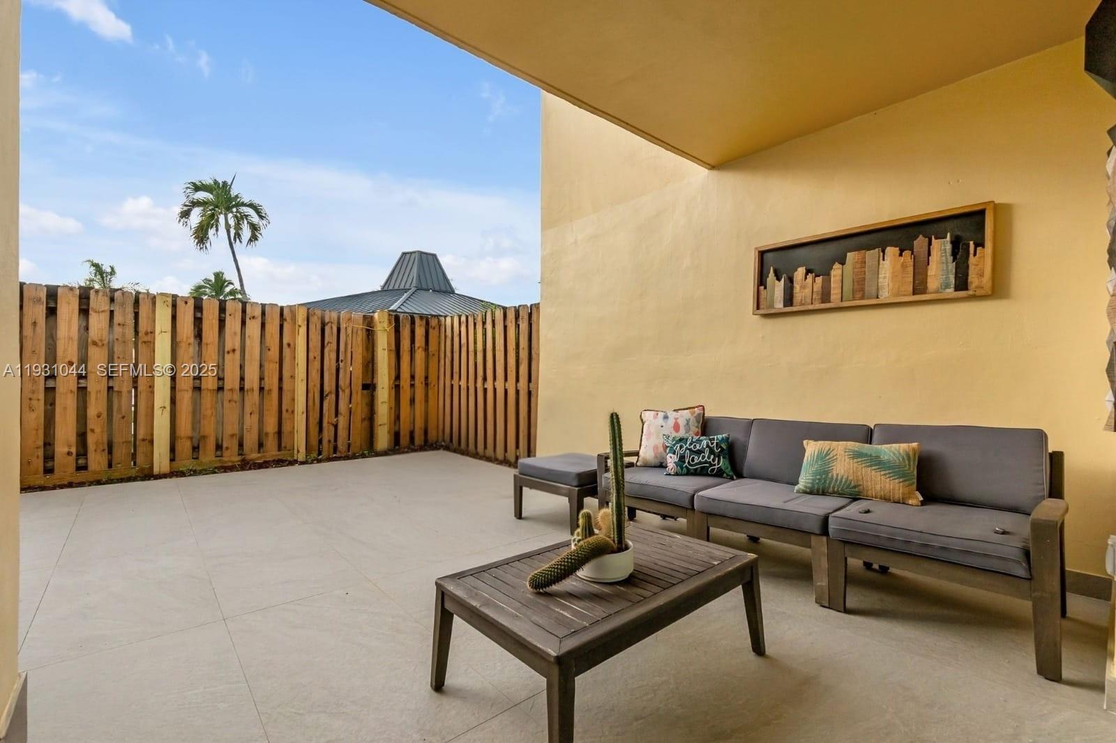 8443 Southwest 137th Avenue, Unit 8443 Miami, FL 33183 - Photo 26 of 29 a living room with furniture