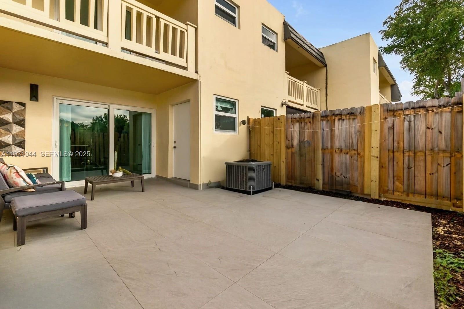 8443 Southwest 137th Avenue, Unit 8443 Miami, FL 33183 - Photo 28 of 29 a view of a house with backyard and sitting area