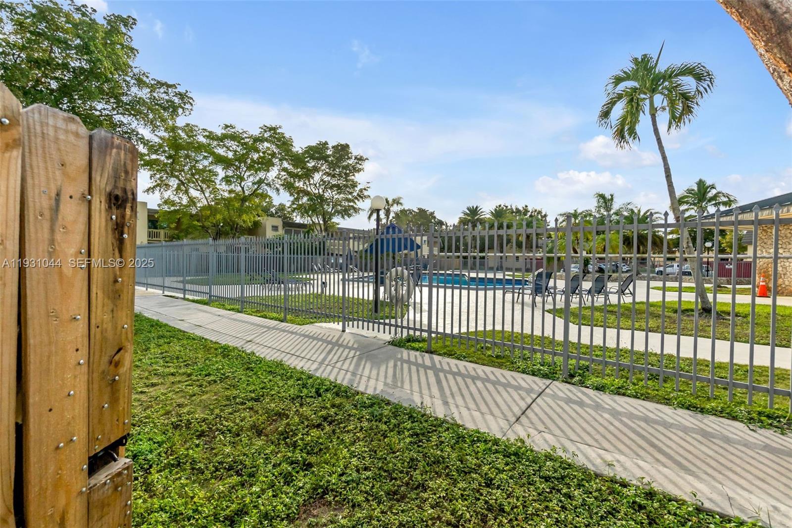 8443 Southwest 137th Avenue, Unit 8443 Miami, FL 33183 - Photo 29 of 29 a view of a backyard and a tree