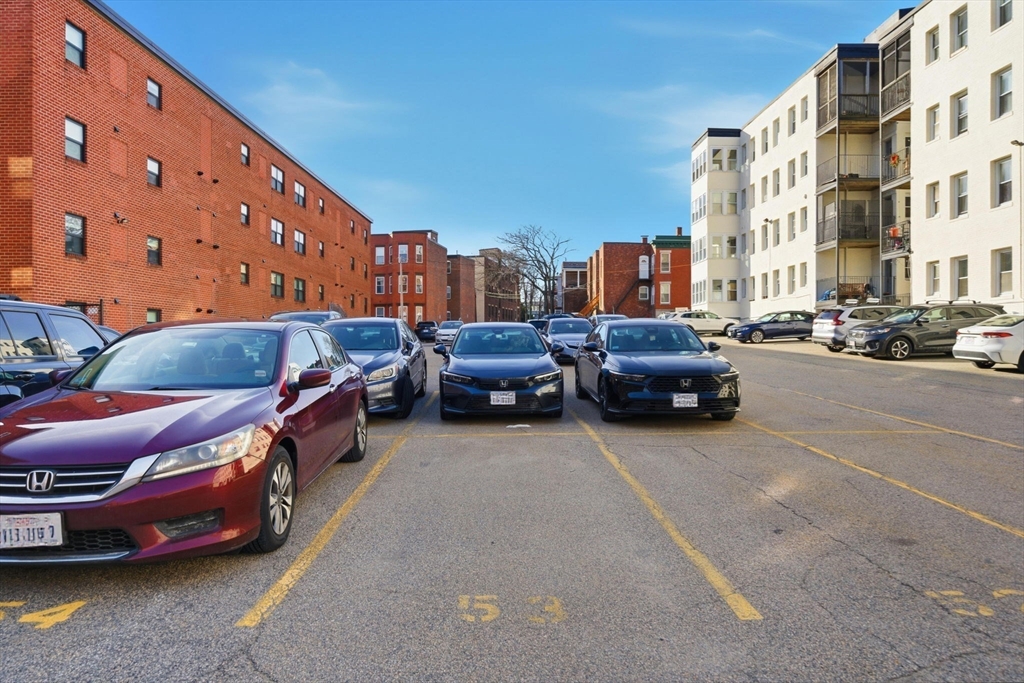 1480 Commonwealth Avenue, Unit 10 Boston, MA 02135 - Photo 18 of 19 a couple of cars parked in front of a building