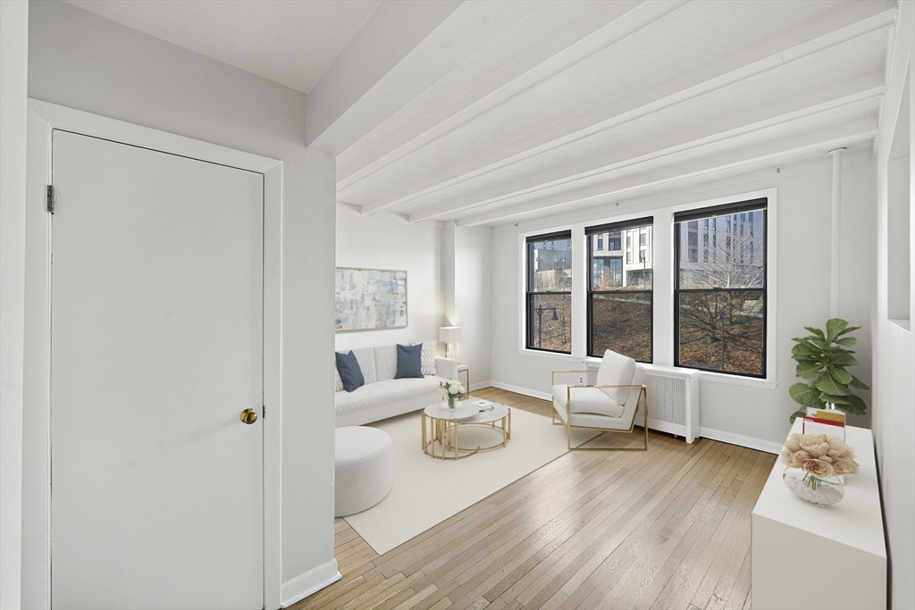 1480 Commonwealth Avenue, Unit 10 Boston, MA 02135 - Photo 3 of 19 a living room with furniture and large windows