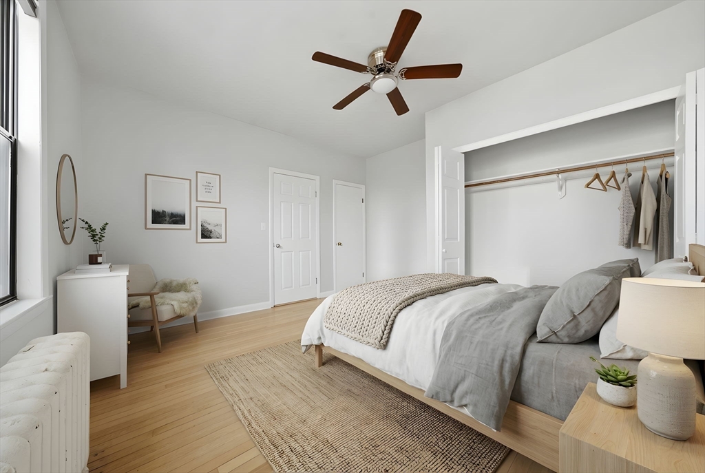 1480 Commonwealth Avenue, Unit 10 Boston, MA 02135 - Photo 4 of 19 a bedroom with a bed and a couch