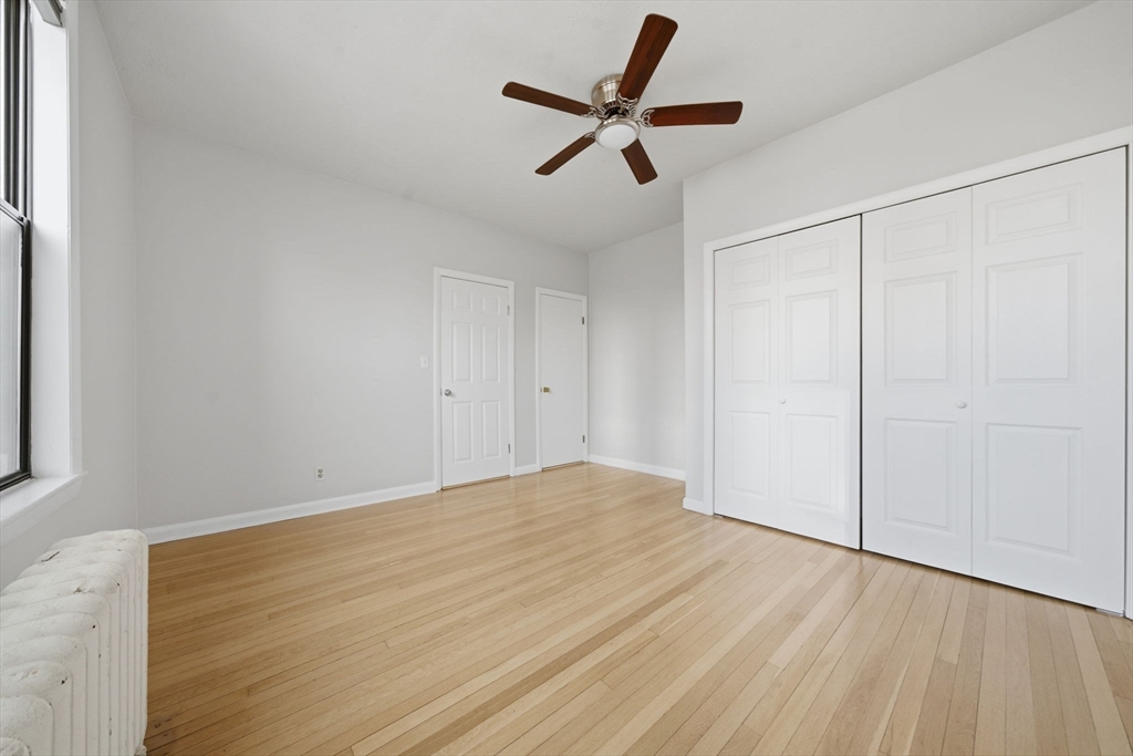 1480 Commonwealth Avenue, Unit 10 Boston, MA 02135 - Photo 6 of 19 wooden floor in an empty room