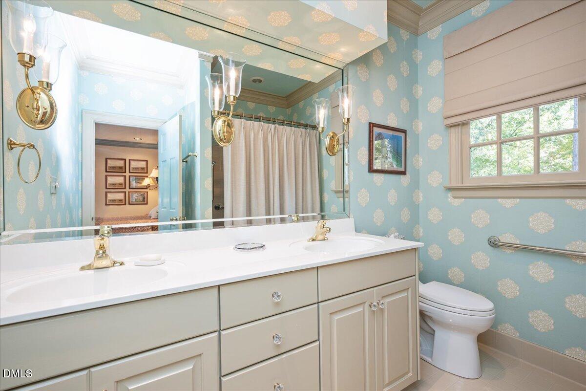 512 Hertford Street Raleigh, NC 27609 - Photo 20 of 39 a bathroom with a sink and a mirror