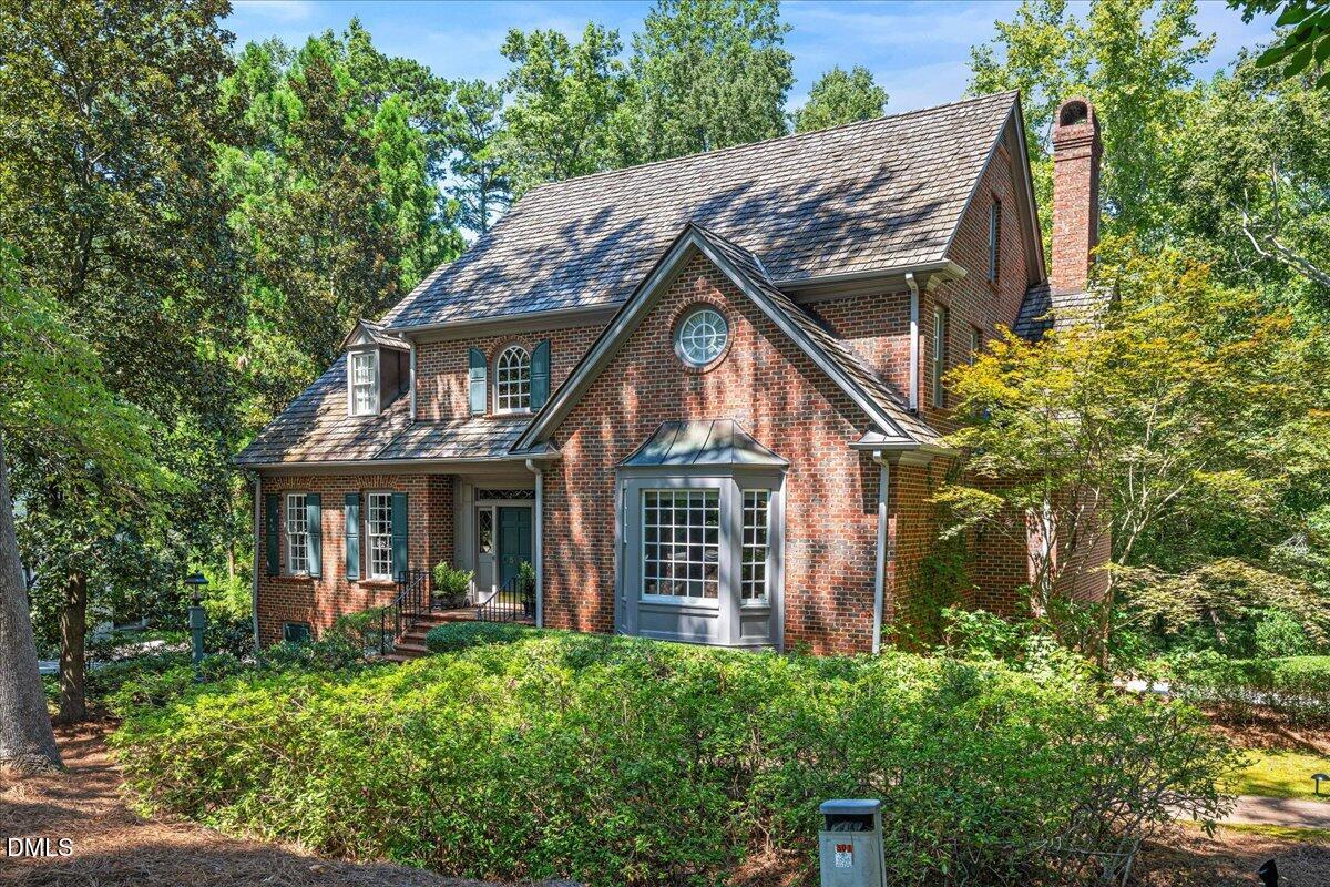 512 Hertford Street Raleigh, NC 27609 - Photo 2 of 39 a view of house with a yard and potted plants